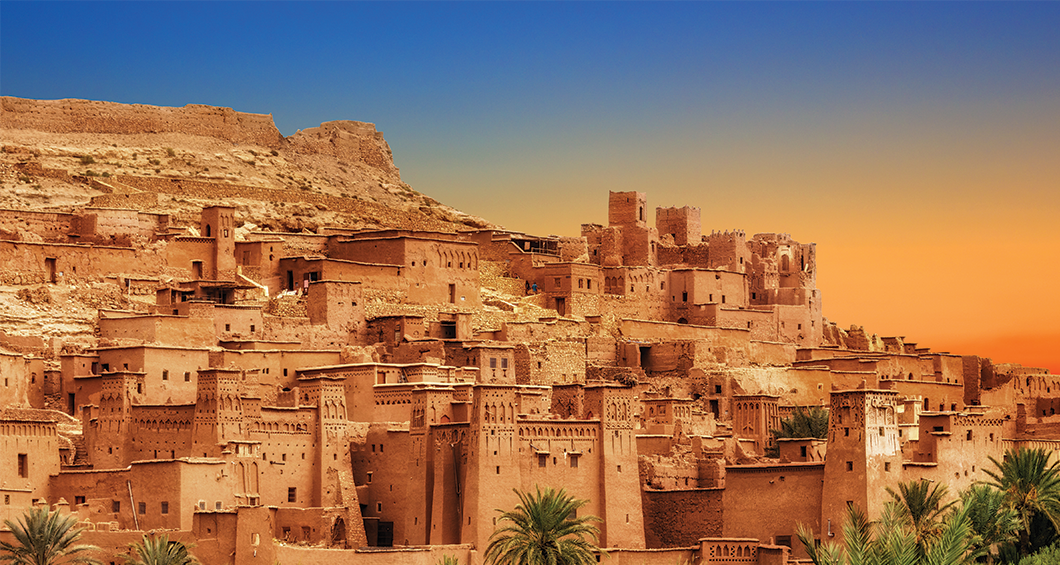Collage of historic Moroccan kasbahs including Aït Benhaddou, Telouet, Tizourgane, Tamnougalt, Ouarzazate, Ait Kine, and M’Gouna