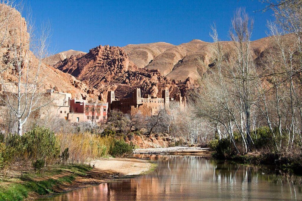 Stunning view of the Dades Valley with its winding roads, rugged cliffs, and lush green oasis