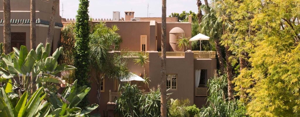 Eco-Luxury Escapes: Discover 2025’s Most Inspiring Sustainable Moroccan Resorts 10 A peaceful oasis in the bustling city of Marrakesh, featuring lush greenery and serene surroundings.