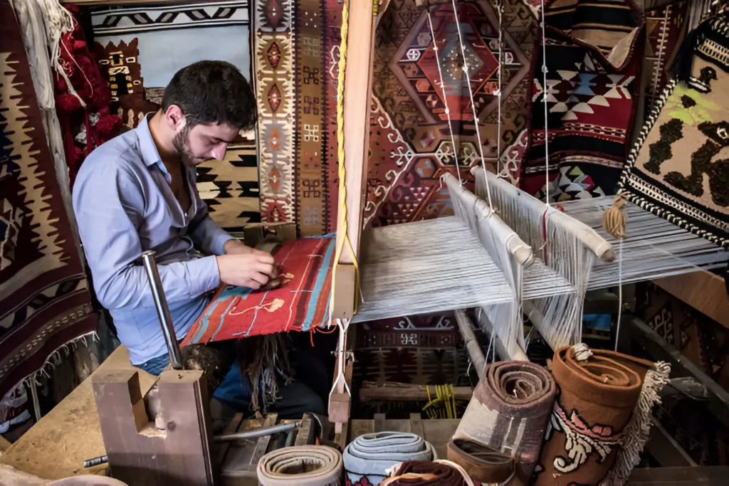 moroccan carpet A Moroccan artisan weaving a traditional rug in a colorful workshop.