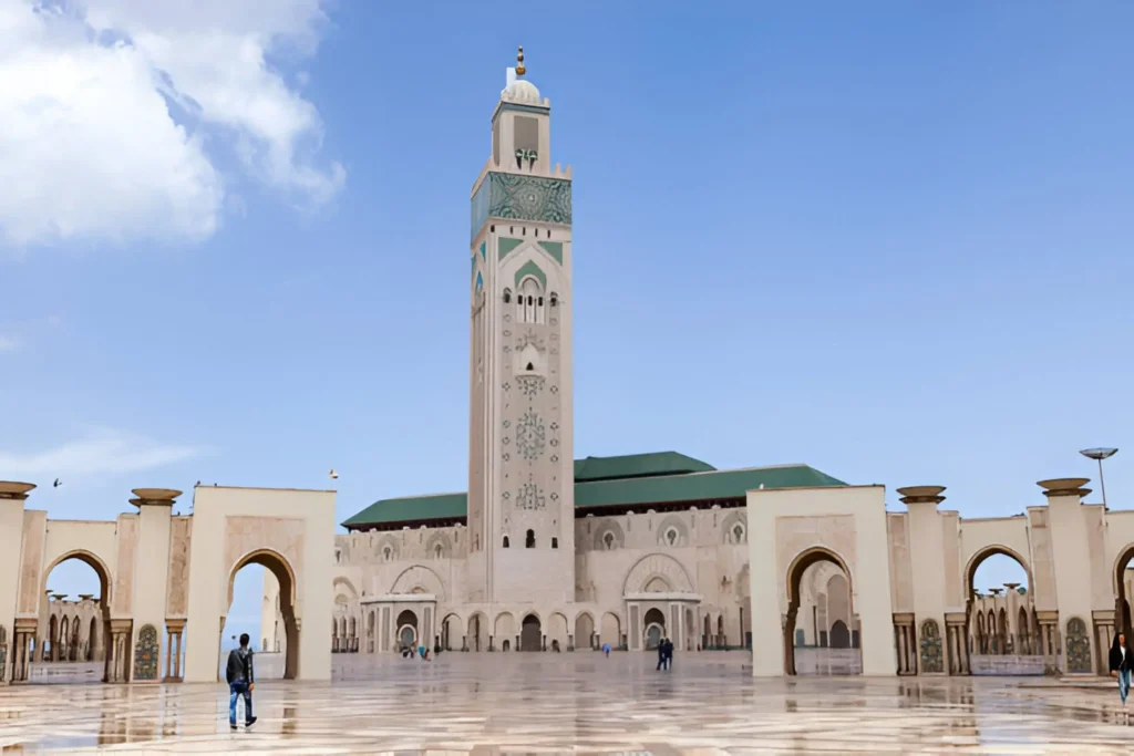 What to Do in Casablanca,The stunning Hassan II Mosque in Casablanca, Morocco, with its towering minaret and oceanfront setting.