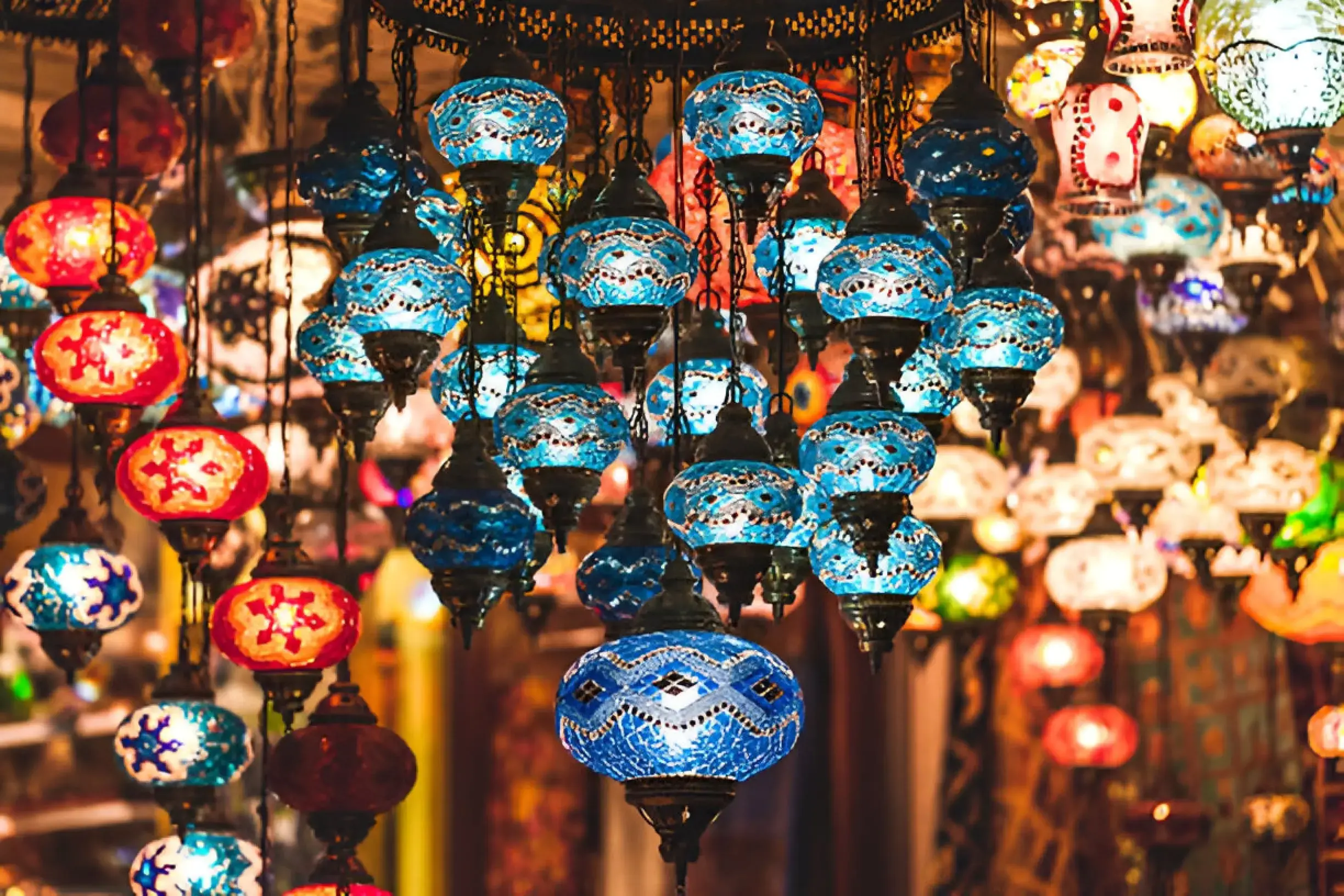 A bustling Moroccan market with colorful textiles and spices on display, capturing the vibrant essence of Morocco's culture.
